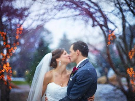 autumn wedding kiss in snow