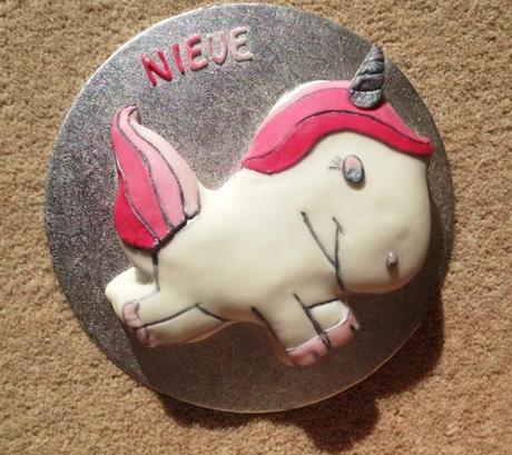 nieve baby name cake pink fluffy unicorn silver outlines and edible glitter