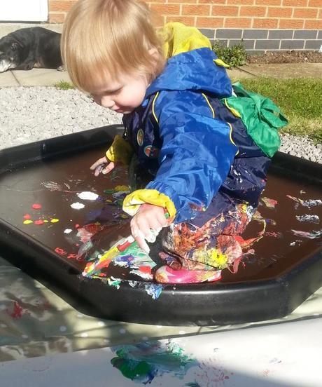 Little Miss A gets really messy with outdoor painting!