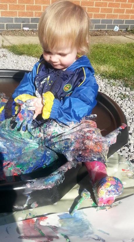 Little Miss A gets really messy with outdoor painting!