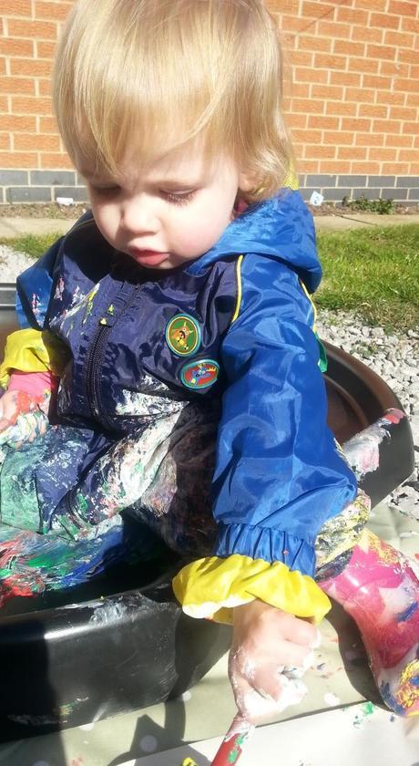 Little Miss A gets really messy with outdoor painting!