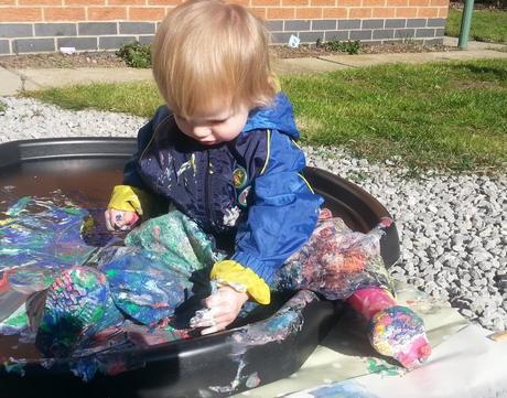 Little Miss A gets really messy with outdoor painting!