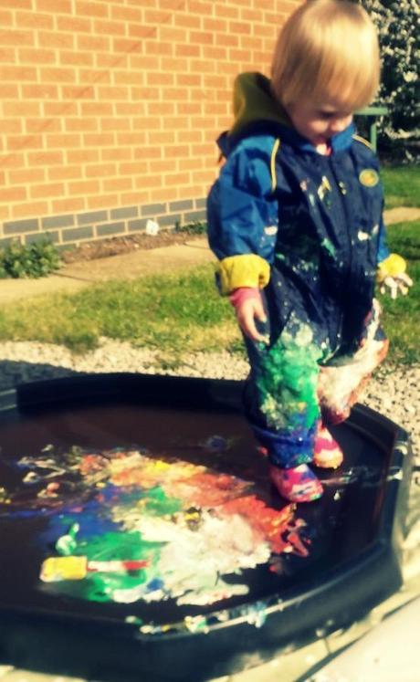 Little Miss A gets really messy with outdoor painting!