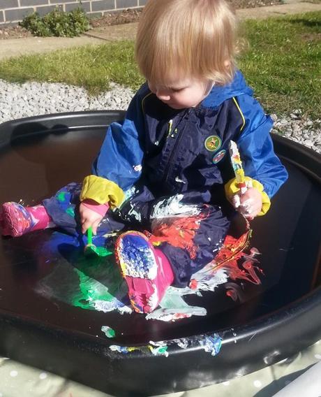 Little Miss A gets really messy with outdoor painting!