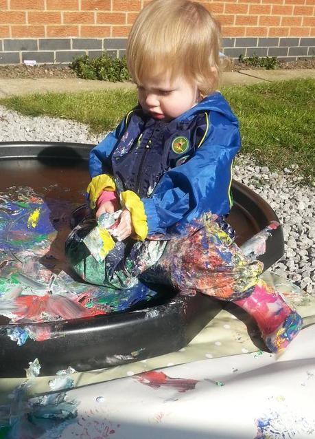 Little Miss A gets really messy with outdoor painting!