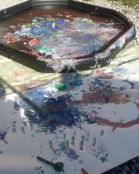 Little Miss A gets really messy with outdoor painting!