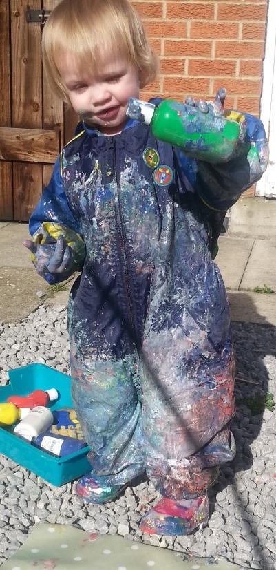 Little Miss A gets really messy with outdoor painting!