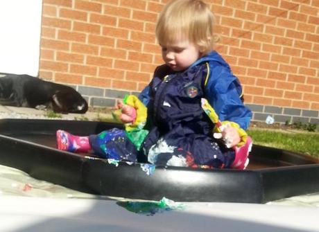 Little Miss A gets really messy with outdoor painting!