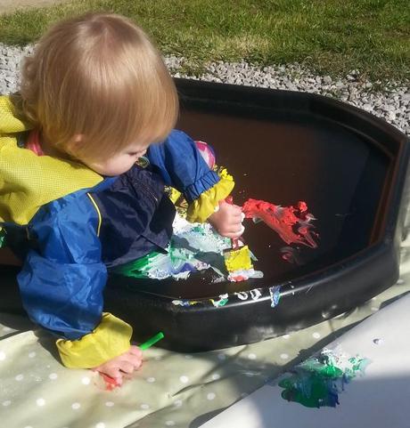 Little Miss A gets really messy with outdoor painting!