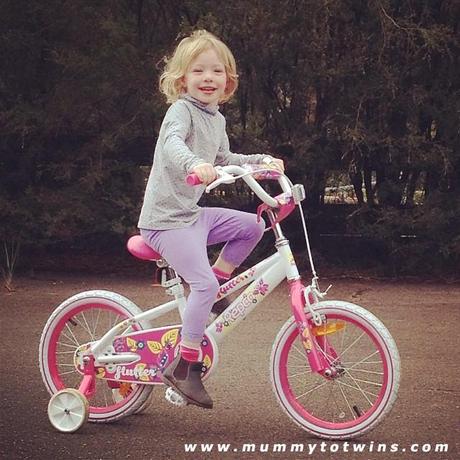Lillian on her big girl bike. She is so happy!