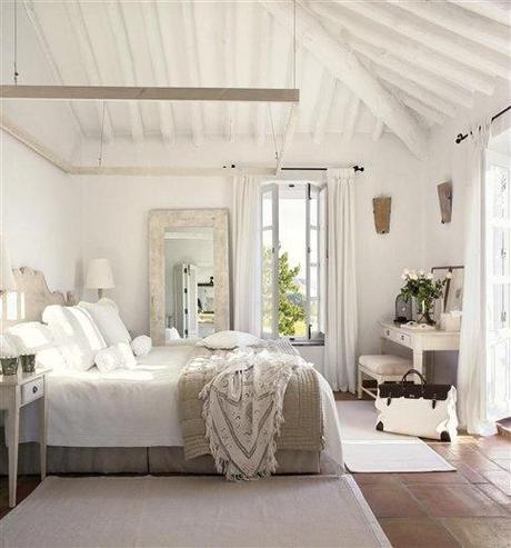 perfect beach house guest bedroom - love the big mirror with the distressed wood frame leaning against the wall
