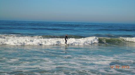 Surfer returning to dry land