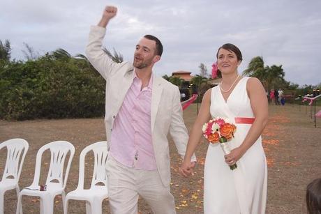 beach wedding groom celebrates