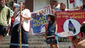 Elyse Vollant, an Innu activist and grandmother, demonstrates against Hydro-Quebec during a major energy conference in Burlington, Vermont in 2012. Photo Credit: Will Bennington