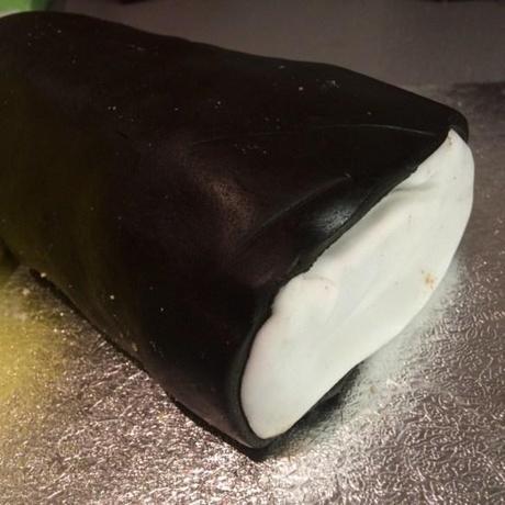 black and white liquorice allsort made of cake chocolate swiss roll covered in fondant