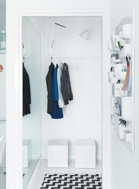 Main entrance with clothing rack and graphic rug