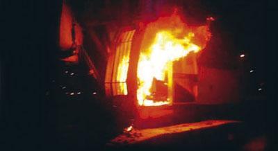 Photo of a burning excavator, April 2011.