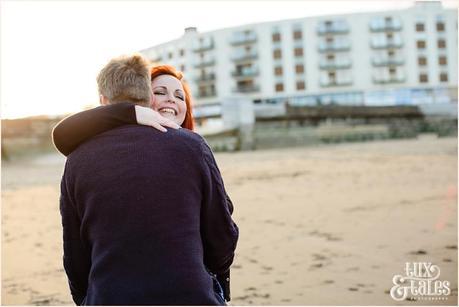 Gorgeous redhead hugs fiance 