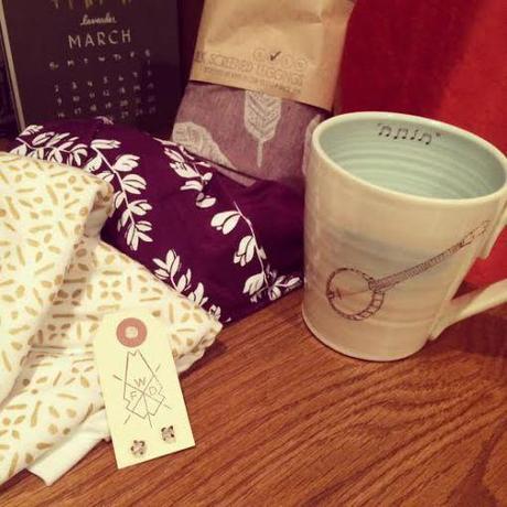 The best haul of lovely handmade gifts from the show. Circle scarves from Little Minnow Designs, banjo mug from Greg Voisin Pottery, earrings from White Feather, silk screened leggings from Whiteout Workshop