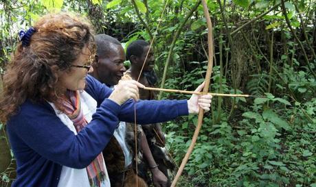 Muzungu and bow and arrow. Batwa community Heritage Trail, Mgahinga Uganda. A project supported by Volcanoes Safaris and Mount Gahinga Lodge