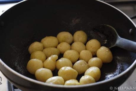 Fry the baby potatoes till golden brown.. 