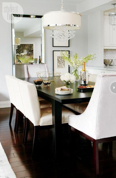 Dining room-by Meredith Heron The simple espresso-stained Parsons-style dining table can extend to seat up to 12 people. The plush upholstered end chairs and dining chairs are comfortable enough to sit in for hours, allowing guests to linger longer after dinner.