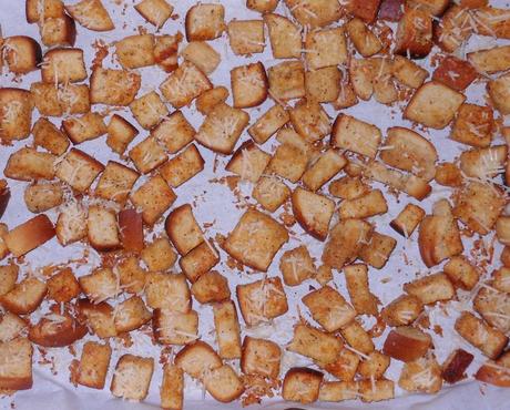 After 15 minutes, I removed the cookie sheets from the oven and stirred the bread crumbs.  The ones on the outside of the pan brown faster than those in the center of the pan.  Then I put it back into the oven.