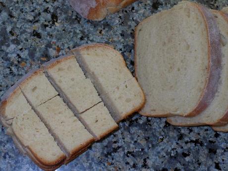 After the garlic olive oil sat for about 6 hours, I continued preparing the croutons.  I cut the bread into thick slices and then cut them into 1-inch cubes.