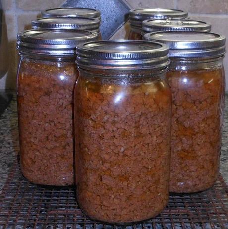 When I removed the jars with my jar lifter, they were still very hot and the meat was still boiling inside the jars.  I left them overnight to cool completely.  This helps ensure a good seal on your jars.