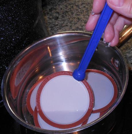 With the jars ready to seal, I removed the seals from the hot water with my lid lifter.  It's a handy magnetic tool which removes the lids without requiring me to touch the hot water.  Nifty, huh?