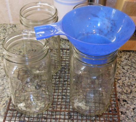 I put my funnel into one of the jars, so I could add my meat without getting the top of the jar greasy (which would interfere with the jar and seal forming a good seal).