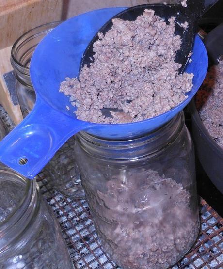 I filled the jars with the meat using a slotted spoon to drain any excess fat from the meat.