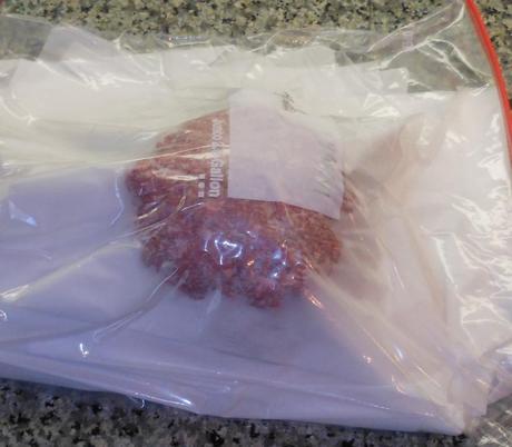 Because I had so many hamburger patties, I used a 2-gallon zip-lock bag.  I pressed out the excess air, sealed the bag, and stuck it in my freezer.