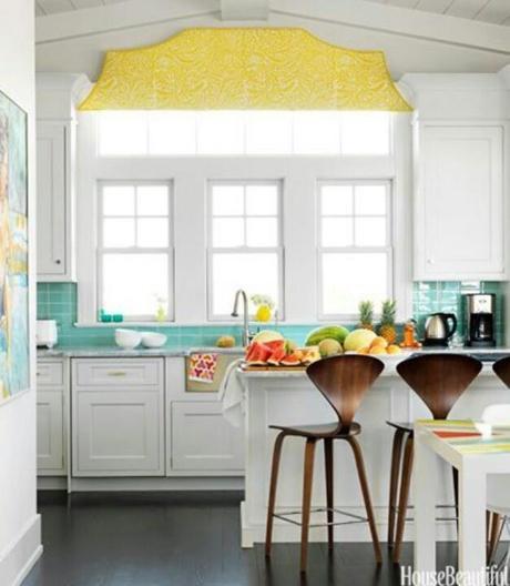 This clean white kitchen brightens up with turquoise and yellow accents.