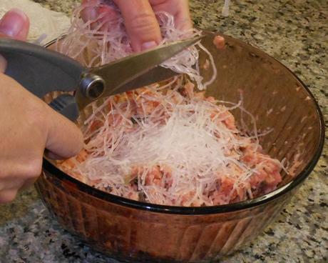 Using my kitchen scissors, I cut up the bean thread noodles.  You can use a knife, but scissors are so much easier!