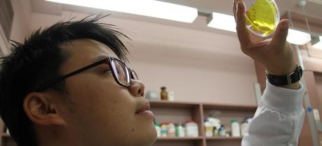 Dr Sam Lau holding up a plastic membrane that has received a ‘shot of botox’.