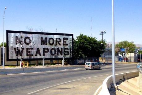 A billboard made from crushed firearms in Mexico near the U.S. border. 