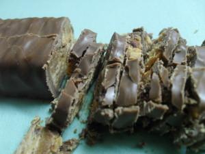 Chocolate Cake with White Frosting and Caramel-Almond chocolate Pieces