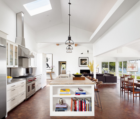 The vaulted ceiling in this kitchen makes the space grand. The added skylight adds to the space by giving it that extra light. I was drawn to it because it’s so airy and spacious.