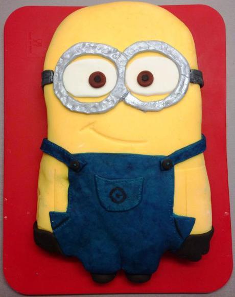 minion two eyed birthday cake from despicable me silver goggles blue overalls gru logo
