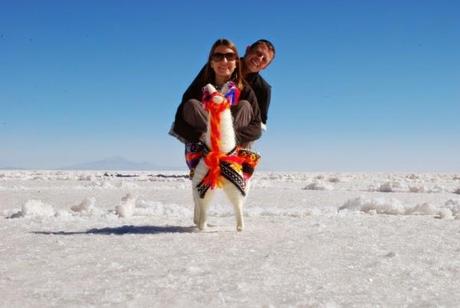 Jeremy and Angie riding a rather small looking llama in Uyuni