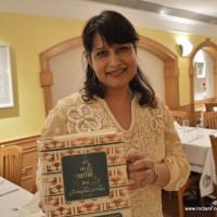 Owner Gurprinder Balcon showing Artusi's book