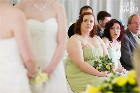 Bridesmaid looks on at wedding ceremony Regen Centre