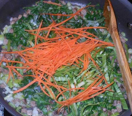 Shortly thereafter, I added the green part of the baby bok choy and my shredded carrot, stirring well to incorporate into the vegetable-beef mixture.