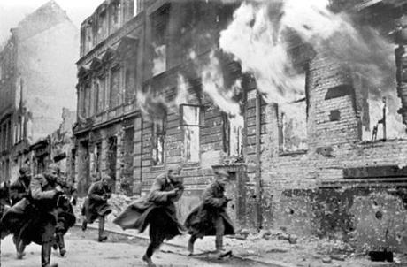 Incredible photo. Soviet soldiers race down a Berlin street in flames.