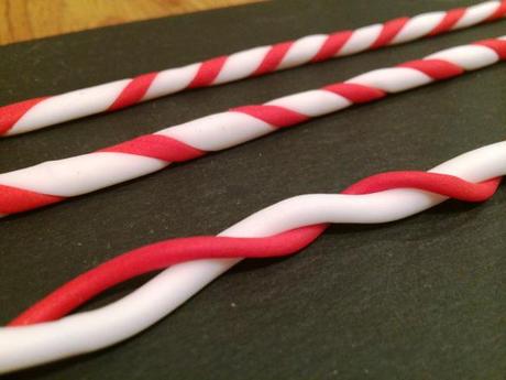 red and white drinking straws made from fondant twisting red and white