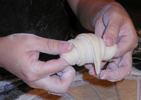 It will look something like this.  Place the dough with the tip facing down onto a greased pan.