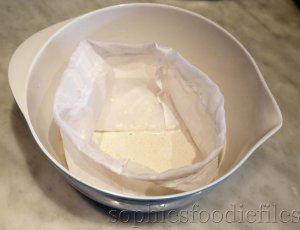 3/ Pouring the sunflower seed milk through the milk bag with the pulp in it!