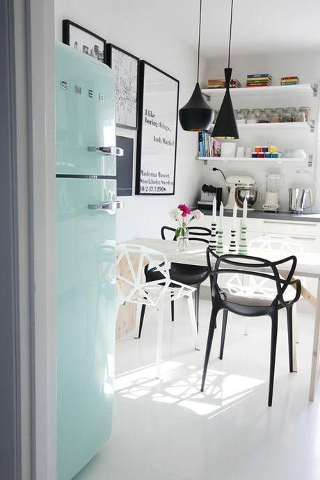 Mint refrigerator, chairs, lamps everything works so well in this kitchen.