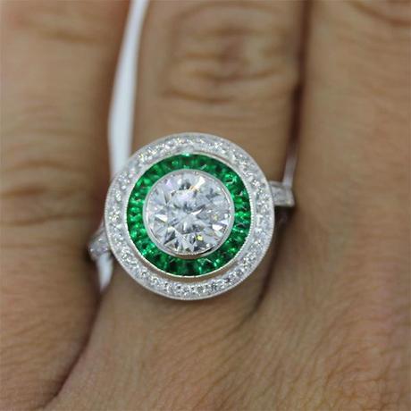 Emerald and diamond halo engagement ring